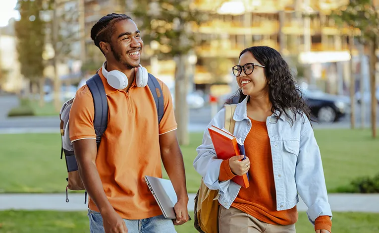 diverse college students walking to class